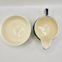 Ceramic bowl and pitcher on a white background