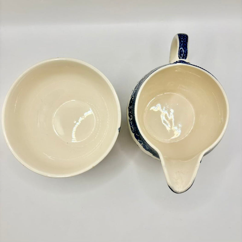 Ceramic bowl and pitcher on a white background