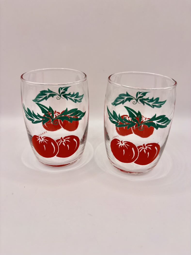 Pair of French tomato juice glasses front view