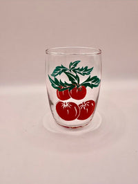 One glass with tomato's drawn on it 