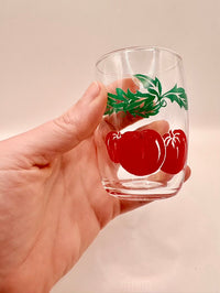 Glass held in hand for scale