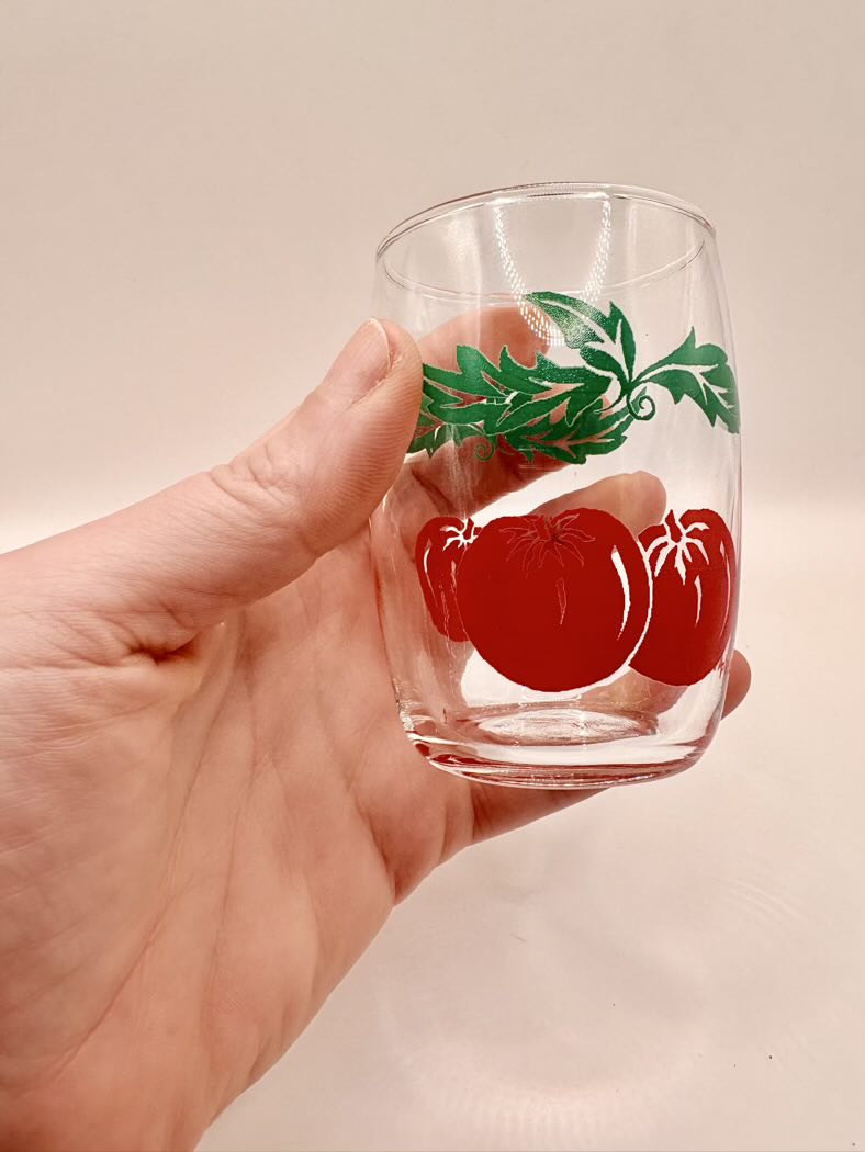 Glass held in hand for scale