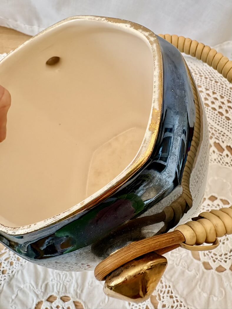 Ceramic pot on a lace tablecloth