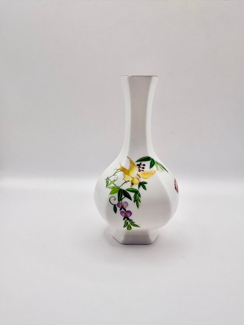 White vase with floral design on a white background