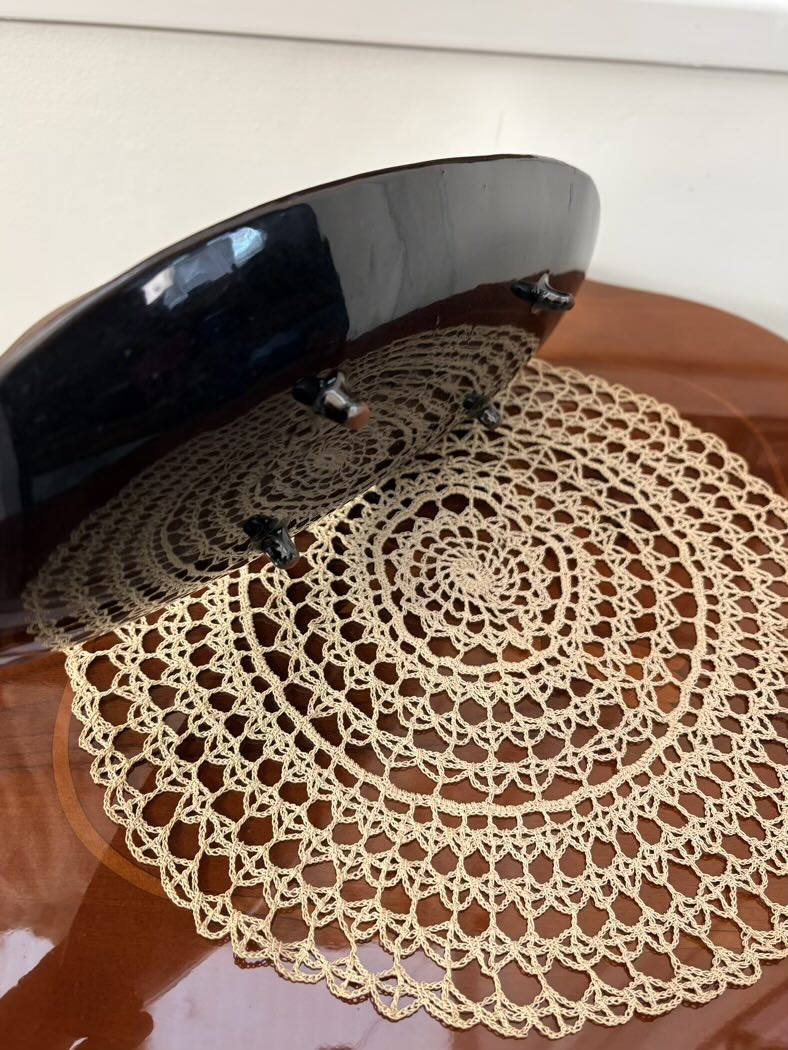 Studio Art Pottery Dish view from a side to show the black painted back and ceramic feets