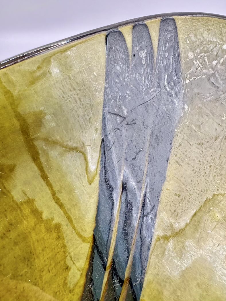 closer look at a green with black paint on