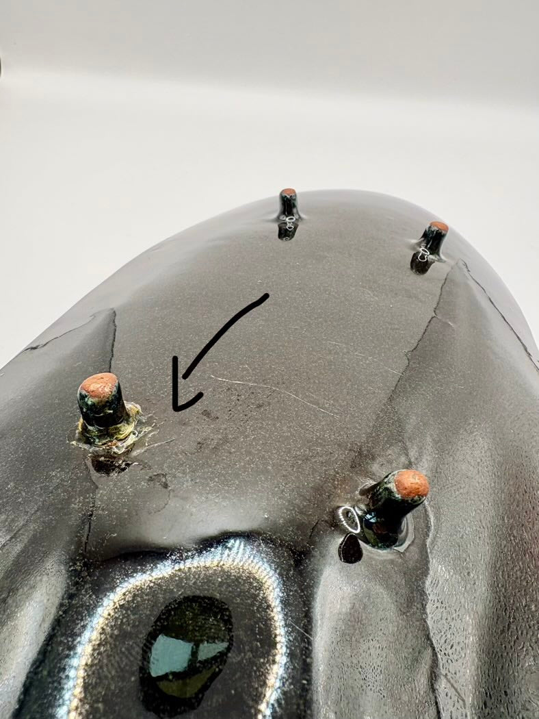 A black Studio Art Pottery Dish showing the back of it