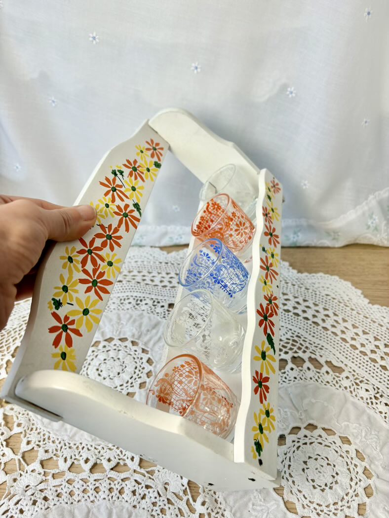 Decorative white support with floral patterns on a lace tablecloth