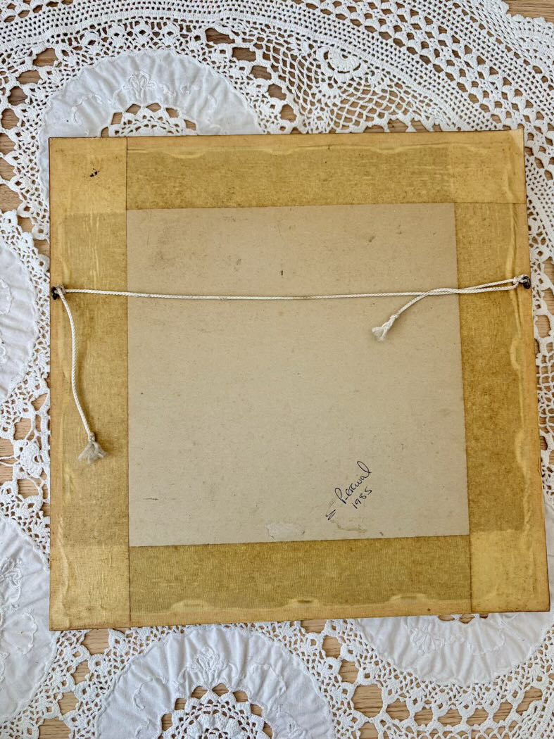 Brown paper bag with a string on a white lace background