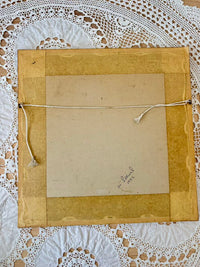 Brown paper bag with a string on a white lace background