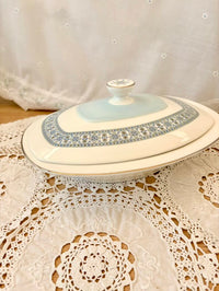 Decorative ceramic dish with lid on a lace tablecloth