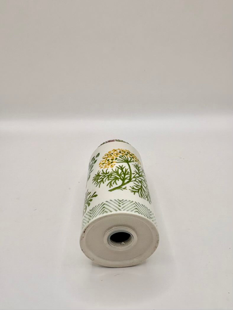 Shaker with a floral design on a white background