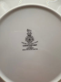 White bottom of a cup with black text and logo on a white background