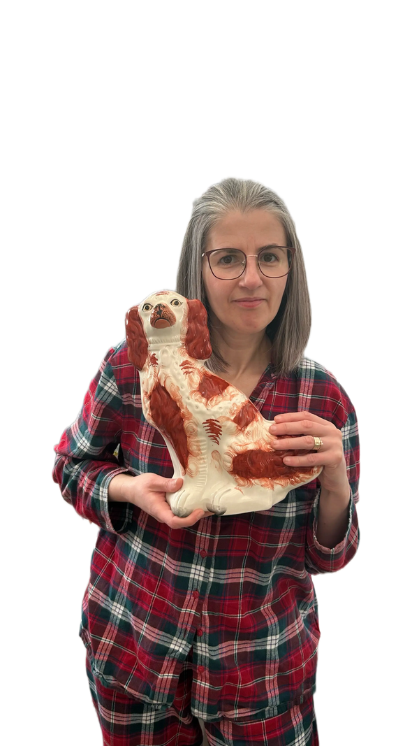 Person holding a large foot-shaped object against a white background