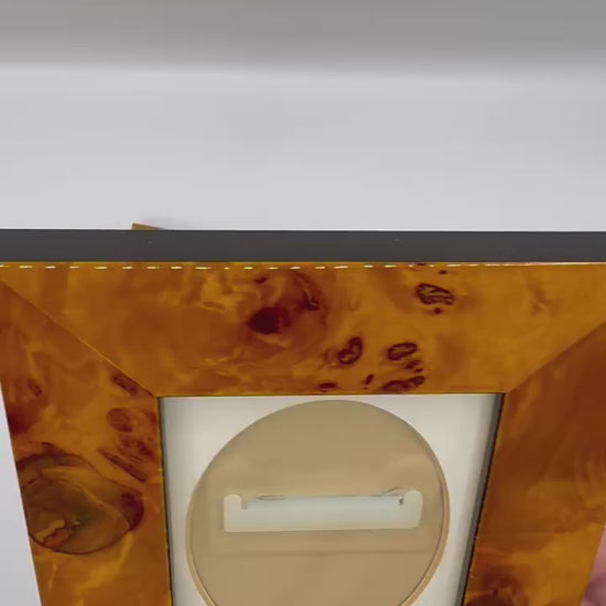Video showing rotation of burl wood frames highlighting wood grain texture