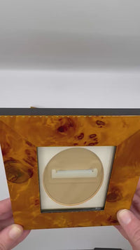 Video showing rotation of burl wood frames highlighting wood grain texture