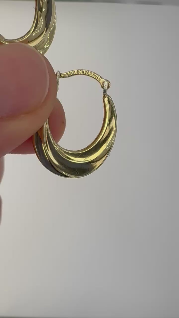 Pair of 9ct bonded gold sterling silver hoop earrings on neutral background