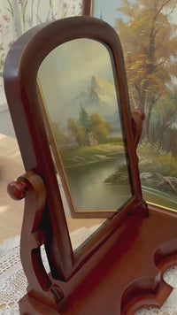 Video showing a 360° view of the Victorian mahogany dressing mirror c.1870, highlighting original glass, carved details, and elegant antique finish.
