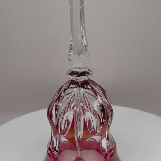Vintage red and clear crystal bell ornament without ringer on display