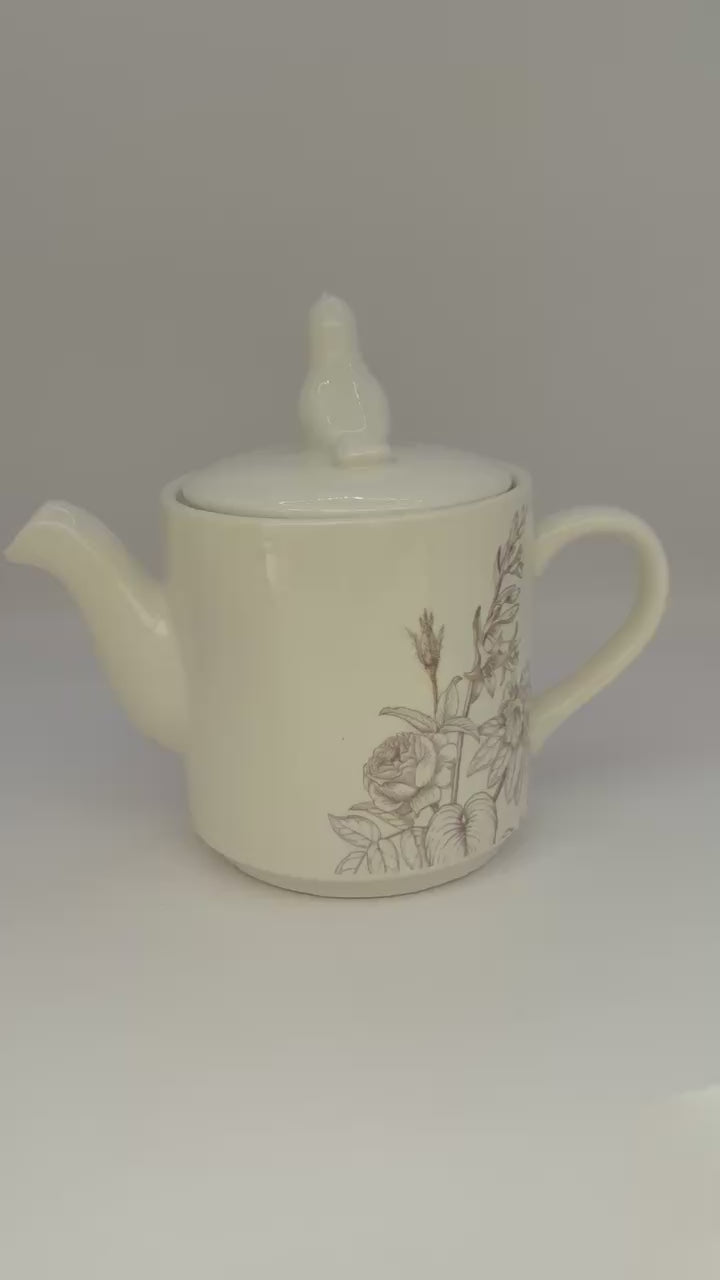 video of RHS-inspired ceramic teapot with floral and bird design
