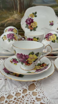 video of Royal Windsor fine bone china tea set with bright pink and yellow rose bouquets, vintage English porcelain