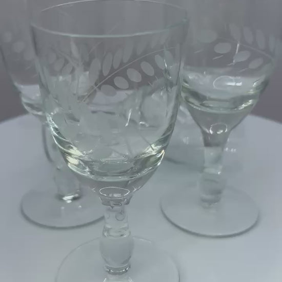 Set of four vintage etched limoncello glasses on a stem, perfect for elegant barware or liqueur tasting