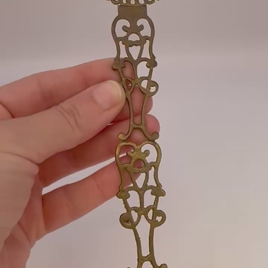 Antique 1960s brass candle snuffer with elegant vintage design