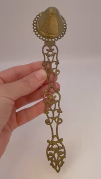 Antique 1960s brass candle snuffer with elegant vintage design