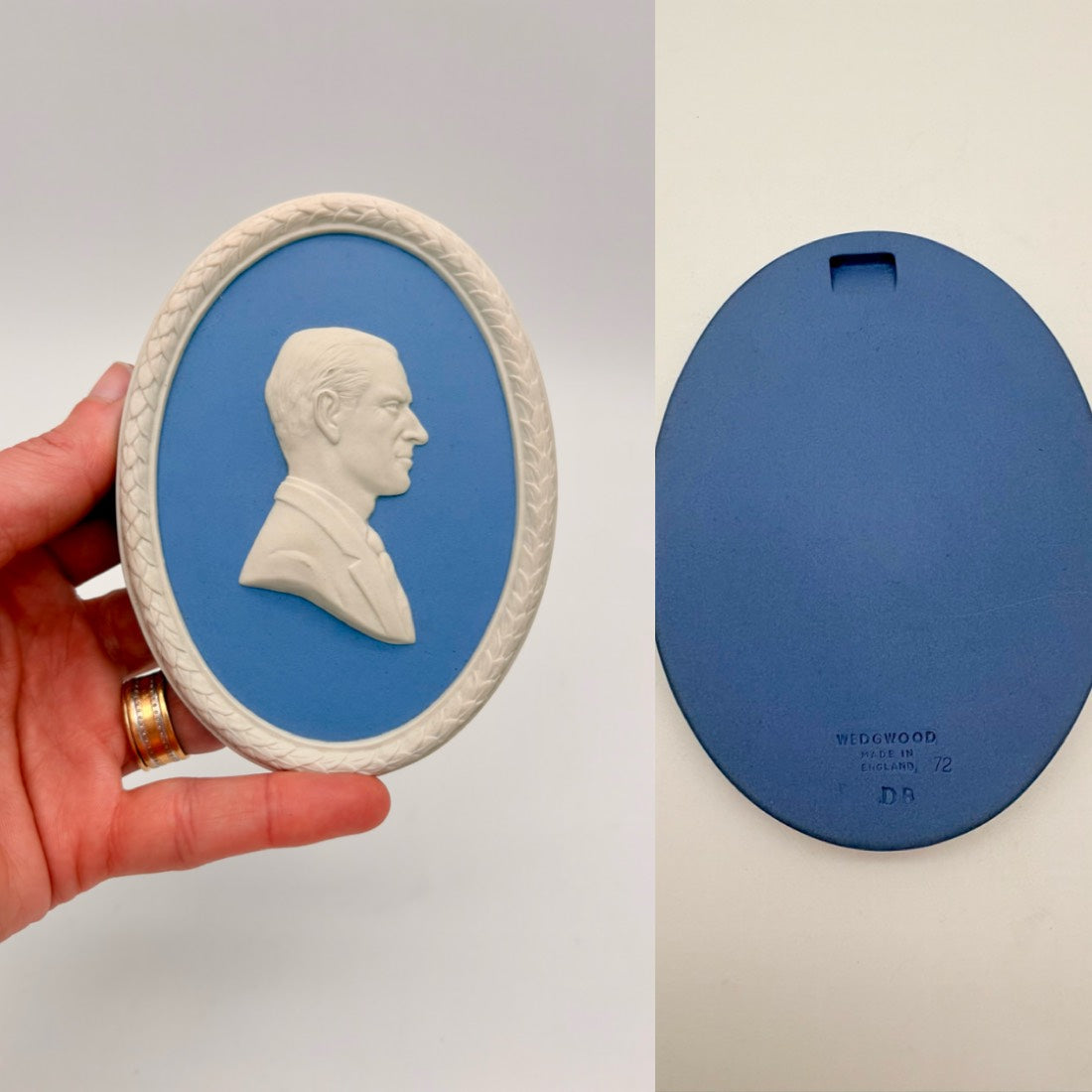 Ceramic oval with a profile portrait on a blue background, held by a hand.