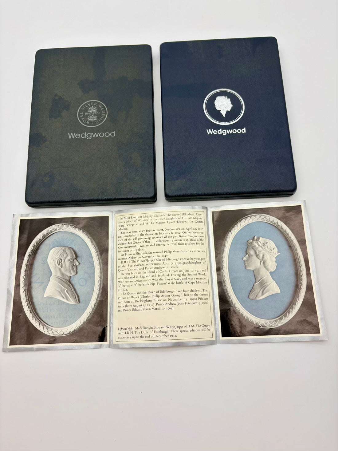 Two Wedgwood boxes with a display of classical portraits and text on a white background